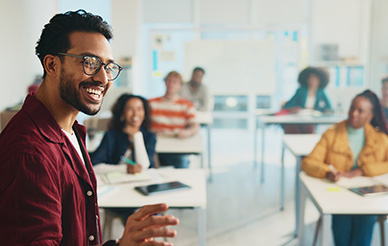 teacher smiling in front of students